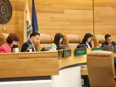 City Council members pictured at the Council Chamber dais during a meeting in 2025